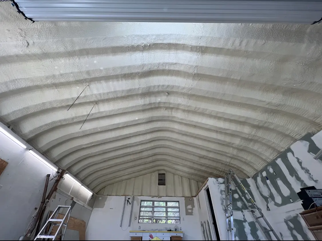 Spray polyurethane foam applied to the underside of a metal roof deck in Kingsburg